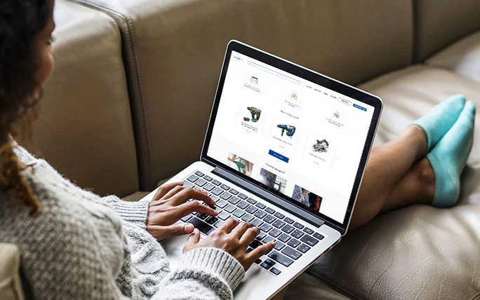 Customer finding rental on laptop