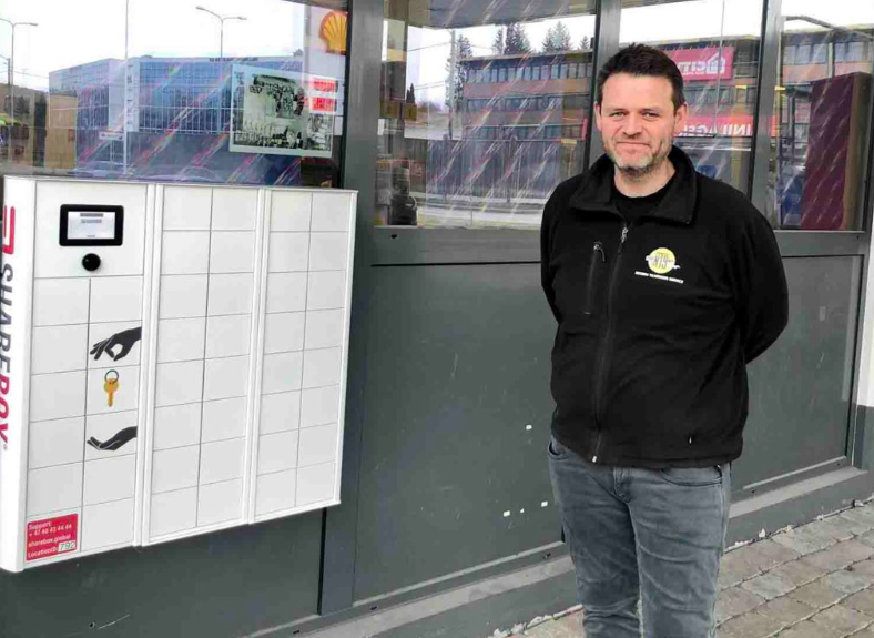 Rental staff beside a self-service locker