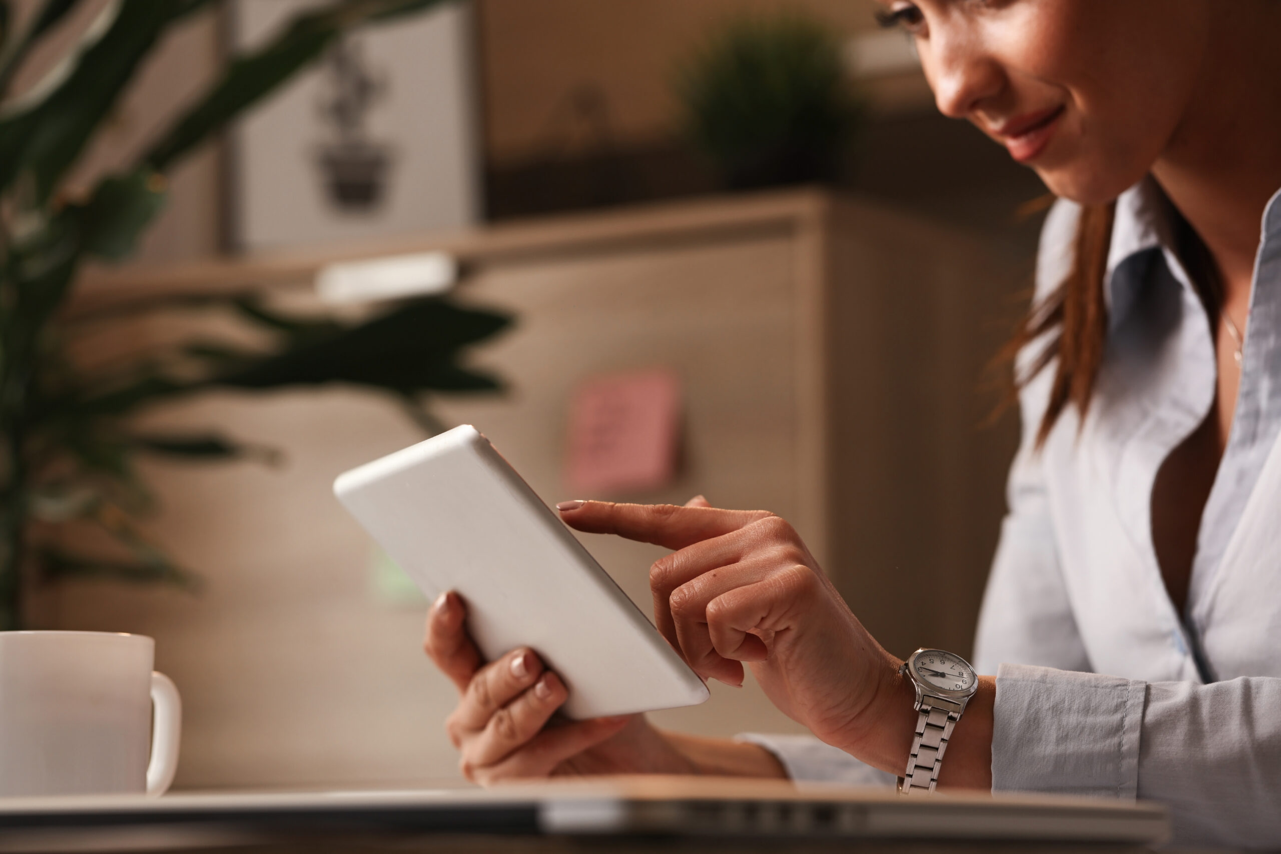a woman checking a touchpad