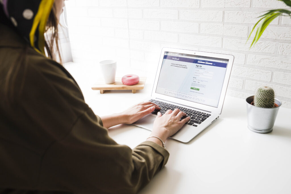 woman setting up a Facebook shop