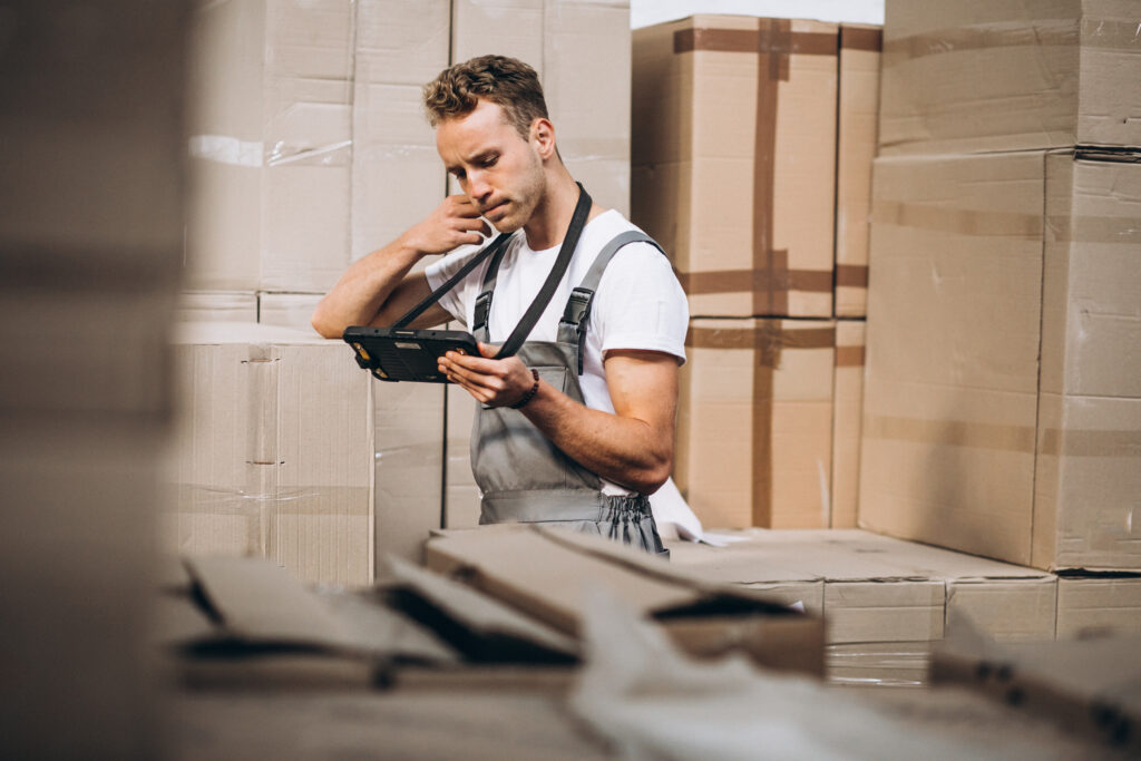 young man working at a storage hall