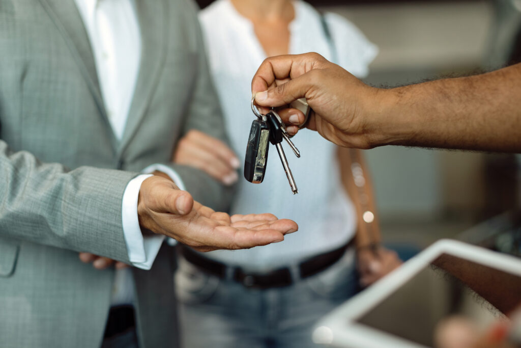 passing the keys to a rented vehicle