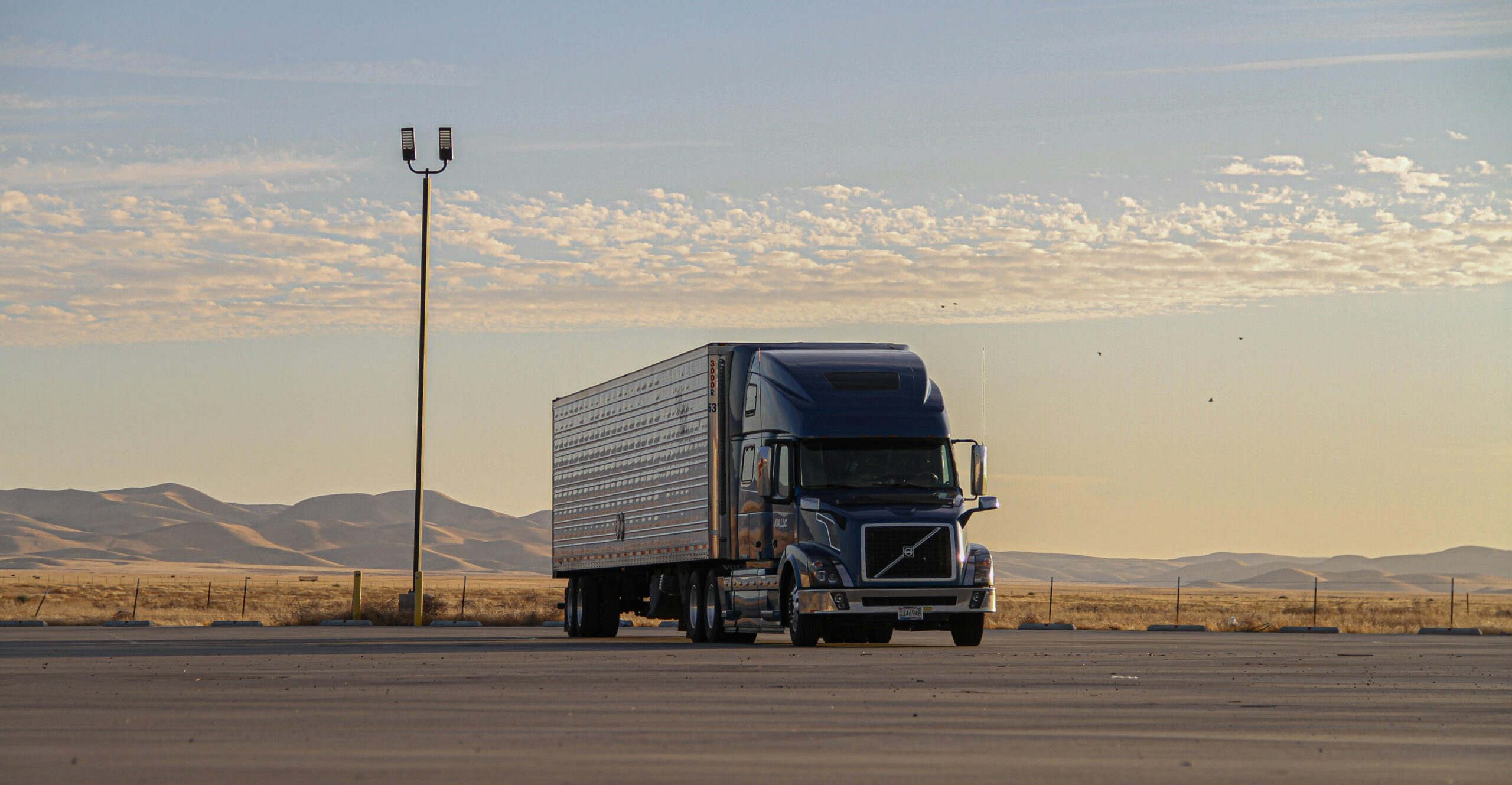 Blue semi-truck rest area desert