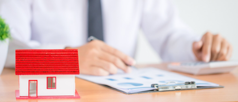 Businessman writing an insurance policy for rental business
