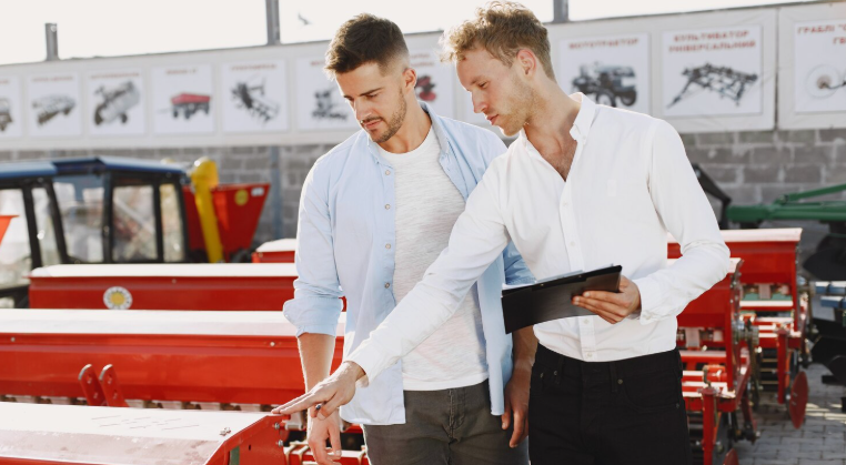 Employee showing equipment for rental