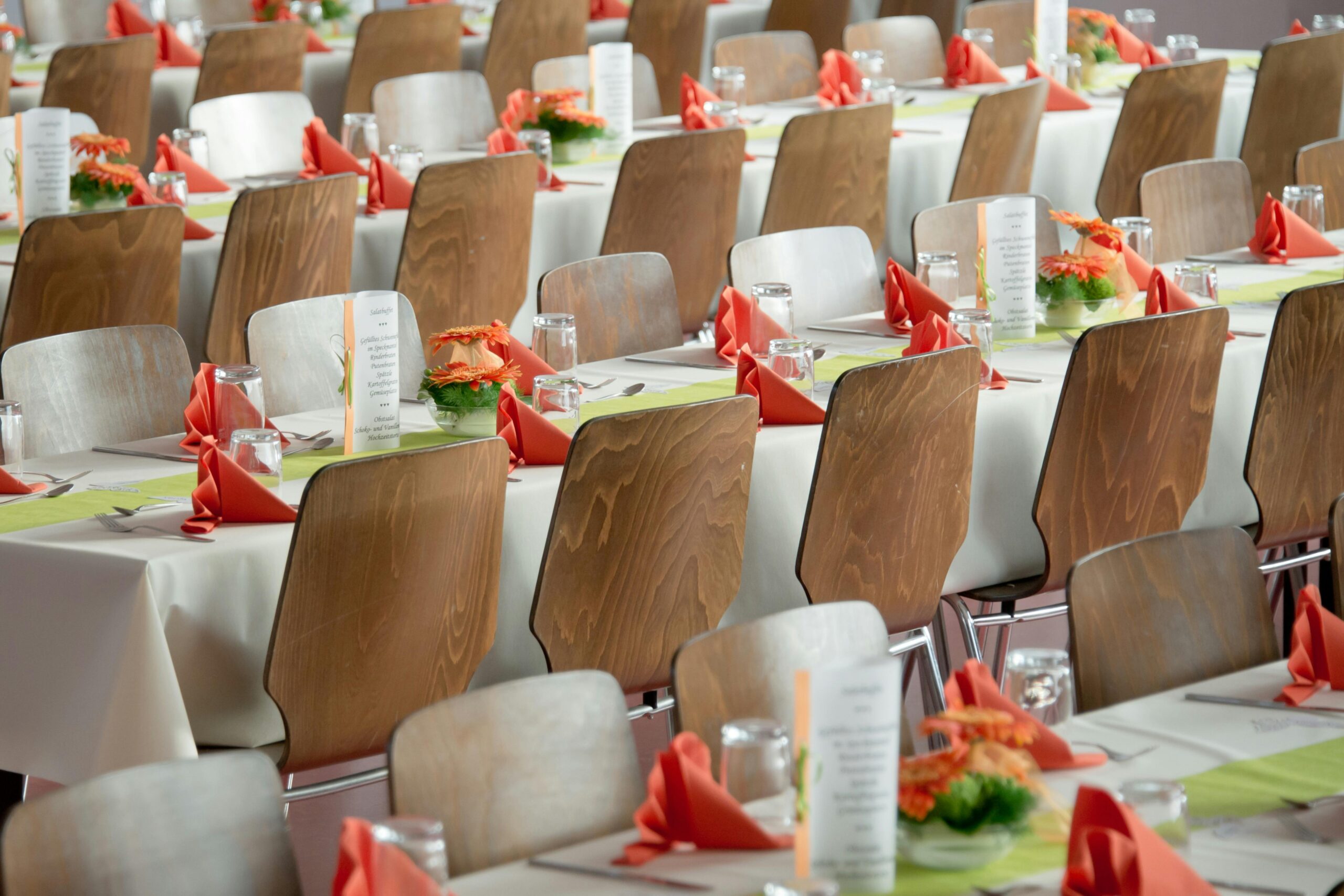 Rows of set banquet tables for large event