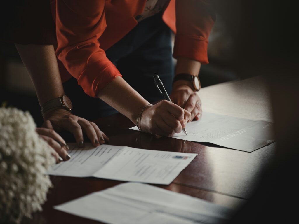 A man signing a rent agreement