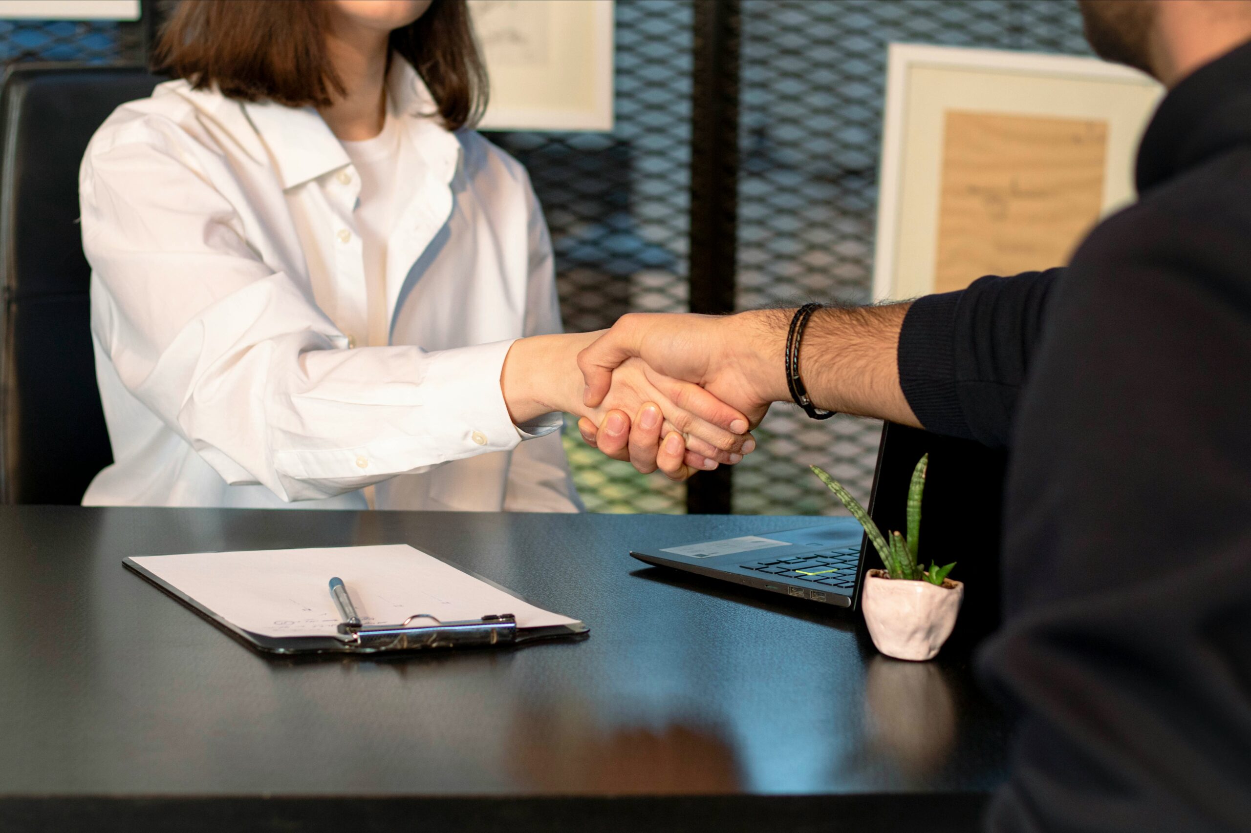 A man shaking hands with a woman