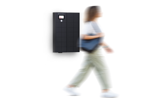 Customer collecting clothing from self-service rental locker