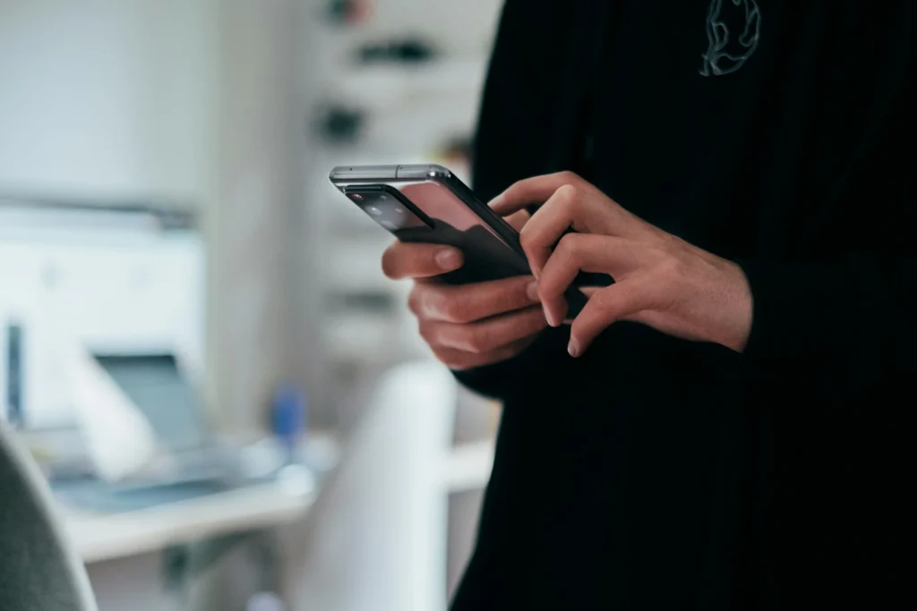 Person texting on phone